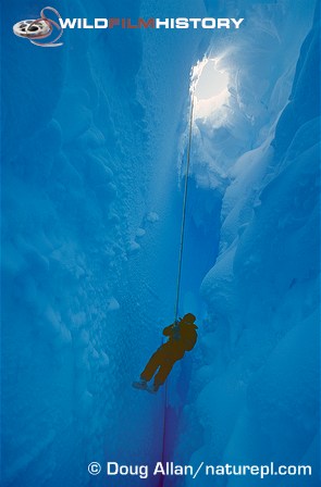 Doug Allan being lowered down a crevasse on location for Life in the Freezer