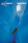 Doug Allan being lowered down a crevasse on location for Life in the Freezer