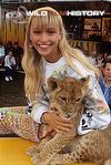 Michaela Strachan with a lion cub for The Really Wild Show