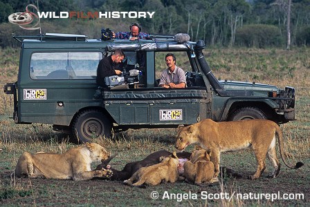 Jonathan Scott watching a lion pride feeding on a carcass for Big Cat Diary