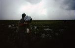 Mark Lamble filming rainstorm on the floodplains