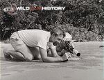 Hass and Lotte Hass filming small crabs on the beach