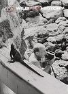 Peter Scott filming marine iguanas in the Galapagos