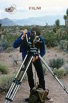 David Thompson with rattlesnake on camera