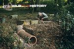 Eric Ashby building a fox den in order to film behaviour