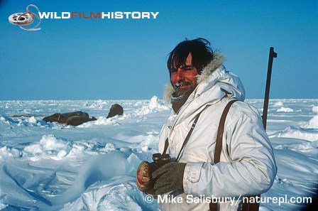 Mike Salisbury with walrus in background on location for Life in the Freezer