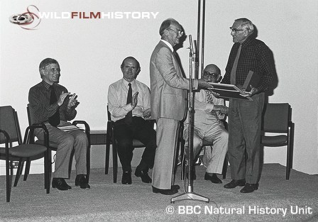 Peter Scott presenting Desmond Hawkins with award at BBC's silver jubilee