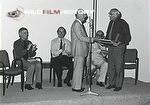 Peter Scott presenting Desmond Hawkins with award at BBC's silver jubilee