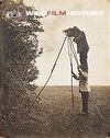 Cherry Kearton standing on Richard Kearton's shoulders to photograph nest high in hedge