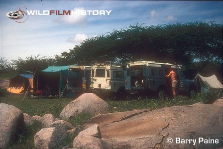 Filming camp with parked landrovers for 