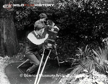 Percy Smith filming in a pond