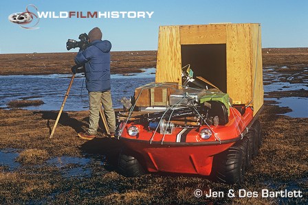 Des Bartlett filming beside an Argo all terrain vehicle