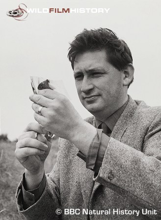 John F. Burton releasing a monarch butterfly