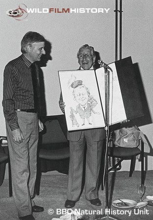 Chris Parsons presenting Johnny Morris with a cartoon of himself