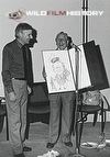 Chris Parsons presenting Johnny Morris with a cartoon of himself