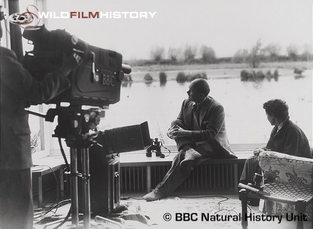 Peter Scott in front of the camera, looking out from his studio at Slimbridge