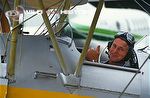 Mike Salisbury in tiger moth bi-plane during filming for The Private Life of Plants