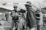 Maurice Fisher filming alongside Pamela Jackson (with clipboard)