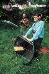 John F. Burton and David Tombs using a home-made stereo parabolic reflector to record the songs of wild birds